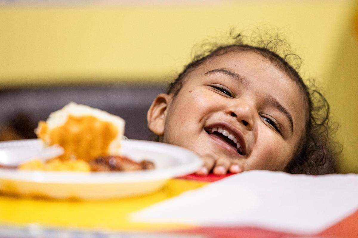 Student Micah Harley, 2, laughs while eating his dinner at the Future Scholars’ Childcare and Transportation child care home in Grand Prairie on Thursday, March 14, 2024. Future Scholars’ is one of a few options in Tarrant County that provide 24/7 child care.