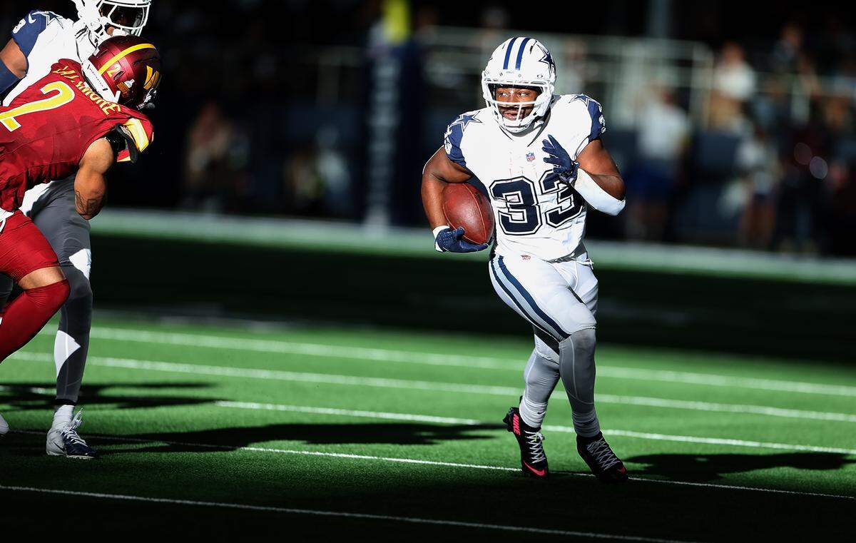 Dallas Cowboys running back Javonte Williams runs during the third quarter Sunday. He finished with 116 yards and a touchdown.