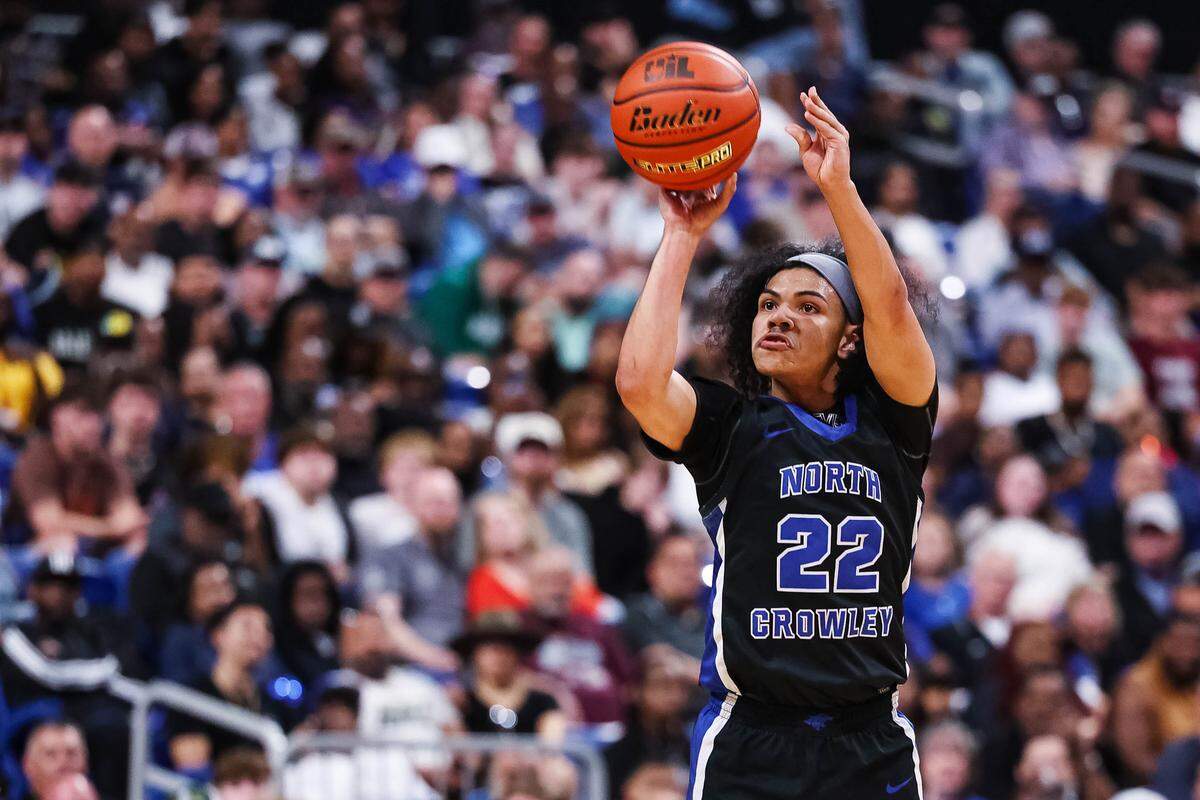 North Crowley guard Isaak Hayes (22) attempts a 3-pointer in the Class 6A Division I state championship game against San Antonio Brennan on Saturday at the Alamodome in San Antonio.