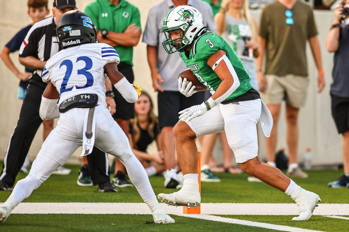 Southlake Carroll running back Davis Penn (3) scores against Trophy Club Byron Nelson’s Jessy Kabeya (23) in a District 4-6A game on Friday, September 13, 2024 at Dragon Stadium in Southlake, Texas.
