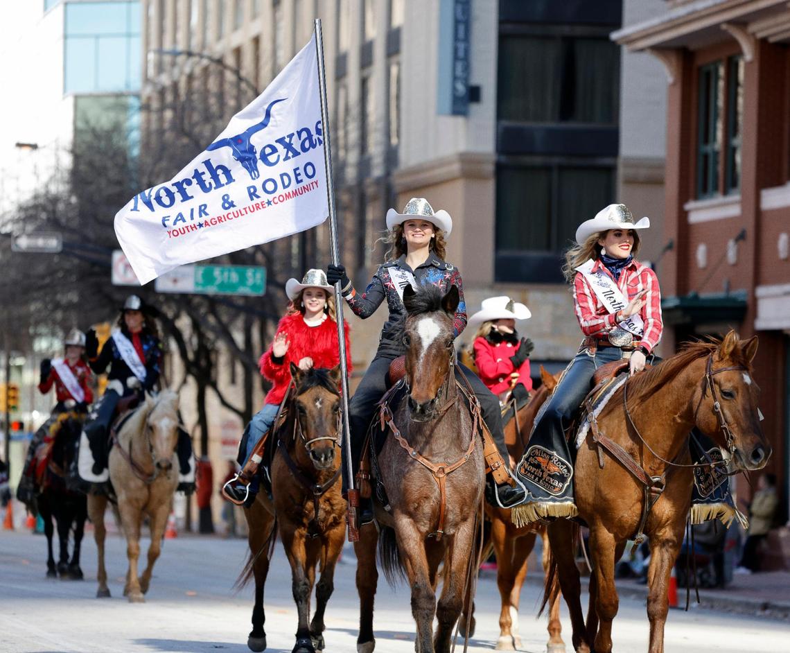 North Texas Fair and Rodeo’s Rodeo Teen and Miss Rodeo lead riders across 5th St. during the Fort Worth Stock Show and Rodeo parade in Fort Worth, Texas, Saturday, Jan, 13, 2024. (Special to the Star-Telegram Bob Booth)