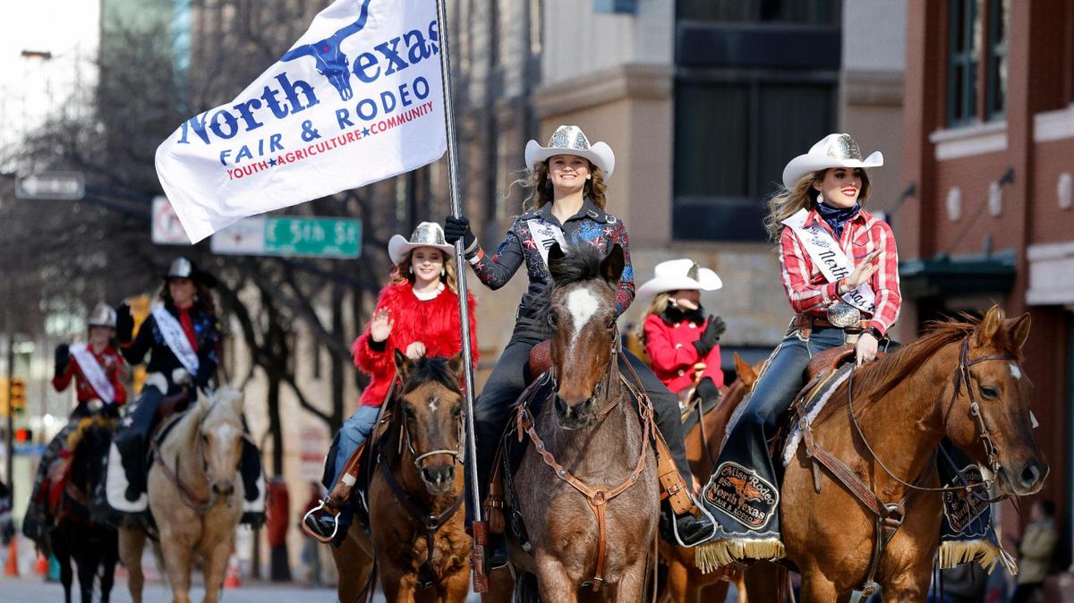 North Texas Fair and Rodeo’s Rodeo Teen and Miss Rodeo lead riders across Fifth Street.