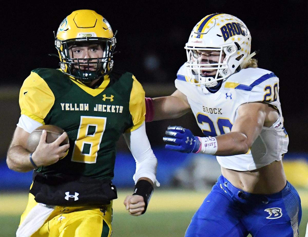 Boyd quarterbackk Rendyn Lamance, left breaks away for a first down as Brock’s Luke Dillingham comes in to make the tackle in the first quarter of their District 4-3A football game Friday, October 23, 2020 at Yellowjacket Stadium in Boyd, Texas. Special/Bob Haynes