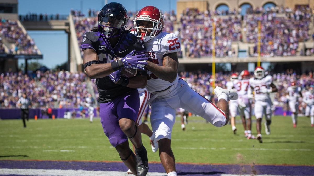 TCU running back Kendre Miller evades Oklahoma safety Justin Broiles to score a touchdown at the Amon G. Carter Stadium in Fort Worth, Texas, on Saturday, Oct. 1, 2022.