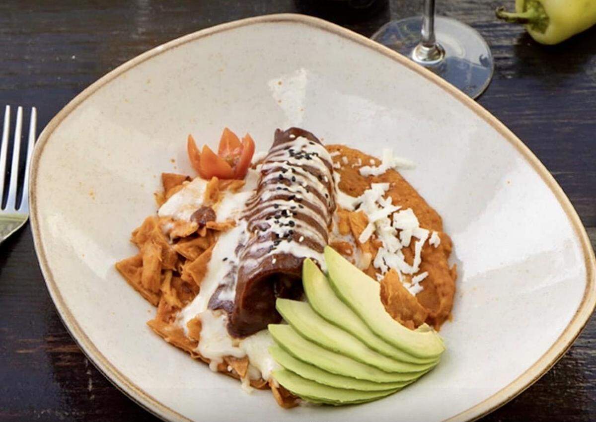 Chilaquiles with an enchilada at Don Artemio Restaurant.