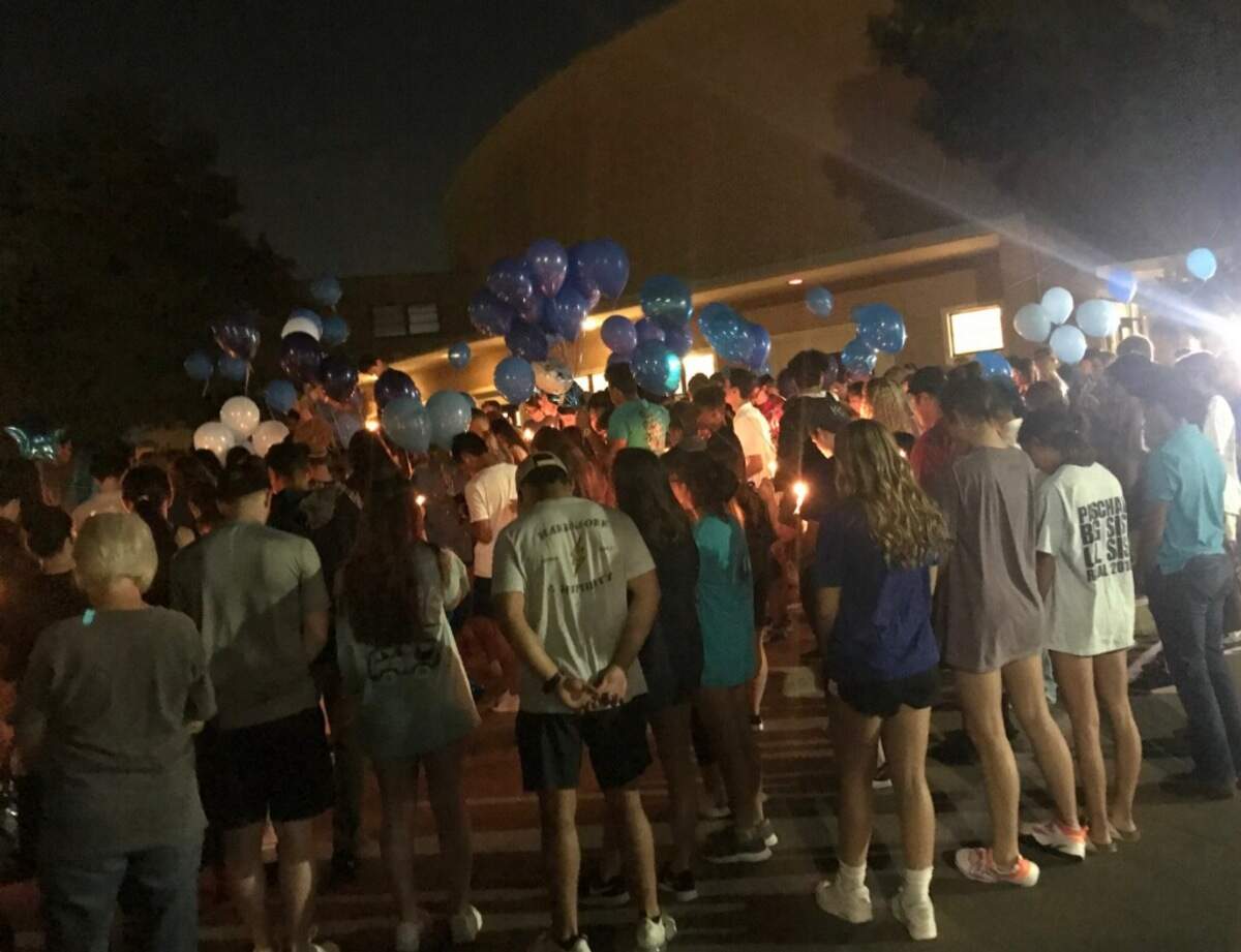 Hundreds gather outside Paschal High School on Wednesday night to mourn the death of Nick Delgadillo. The 17-year-old junior died Tuesday in a car accident near the school.