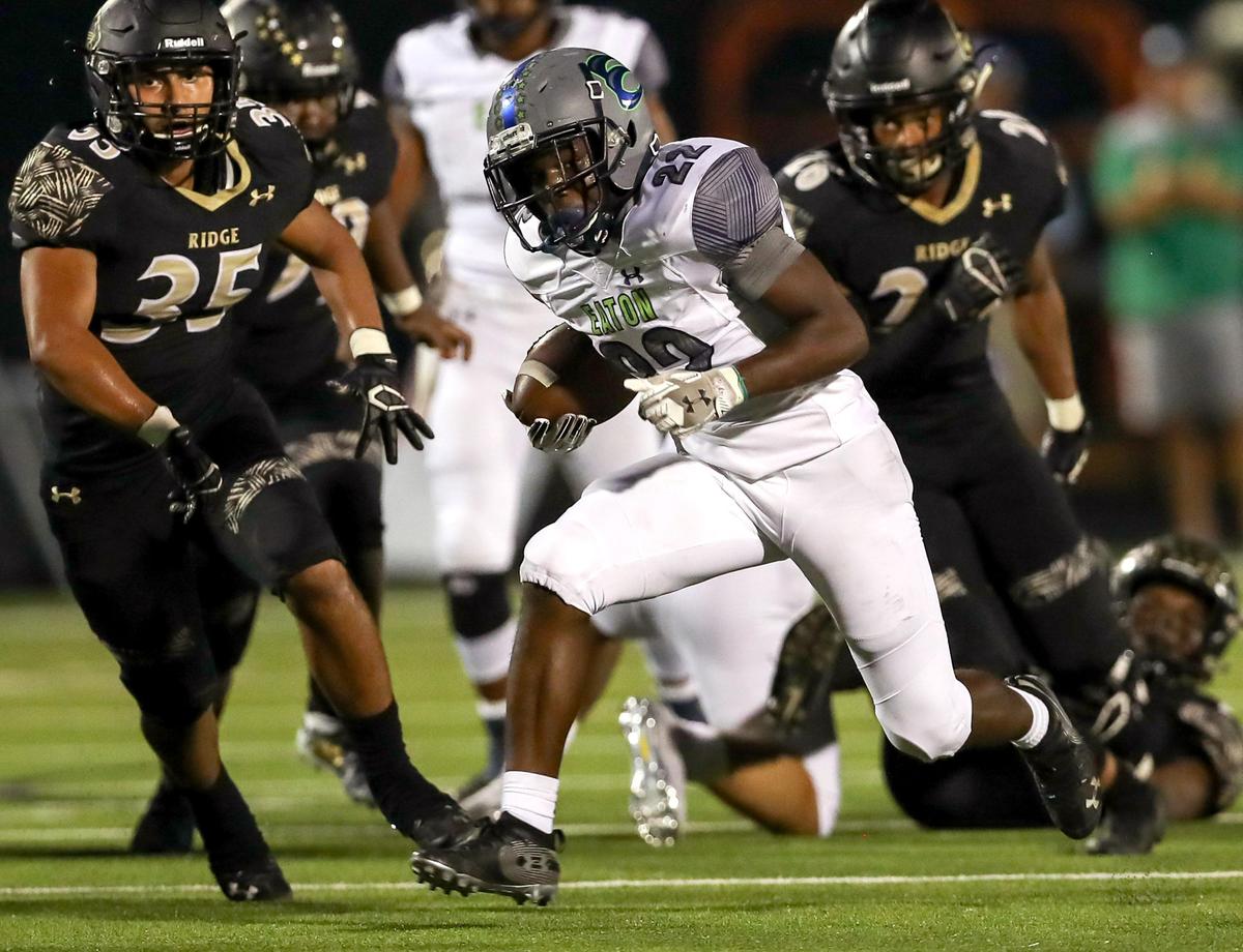 Eaton running back Jahbez Hawkins (22) finds a hole against Keller Fossil Ridge during the first half, Thursday night, October 3 2019 played at the Keller ISD Sports Complex in Keller, TX.