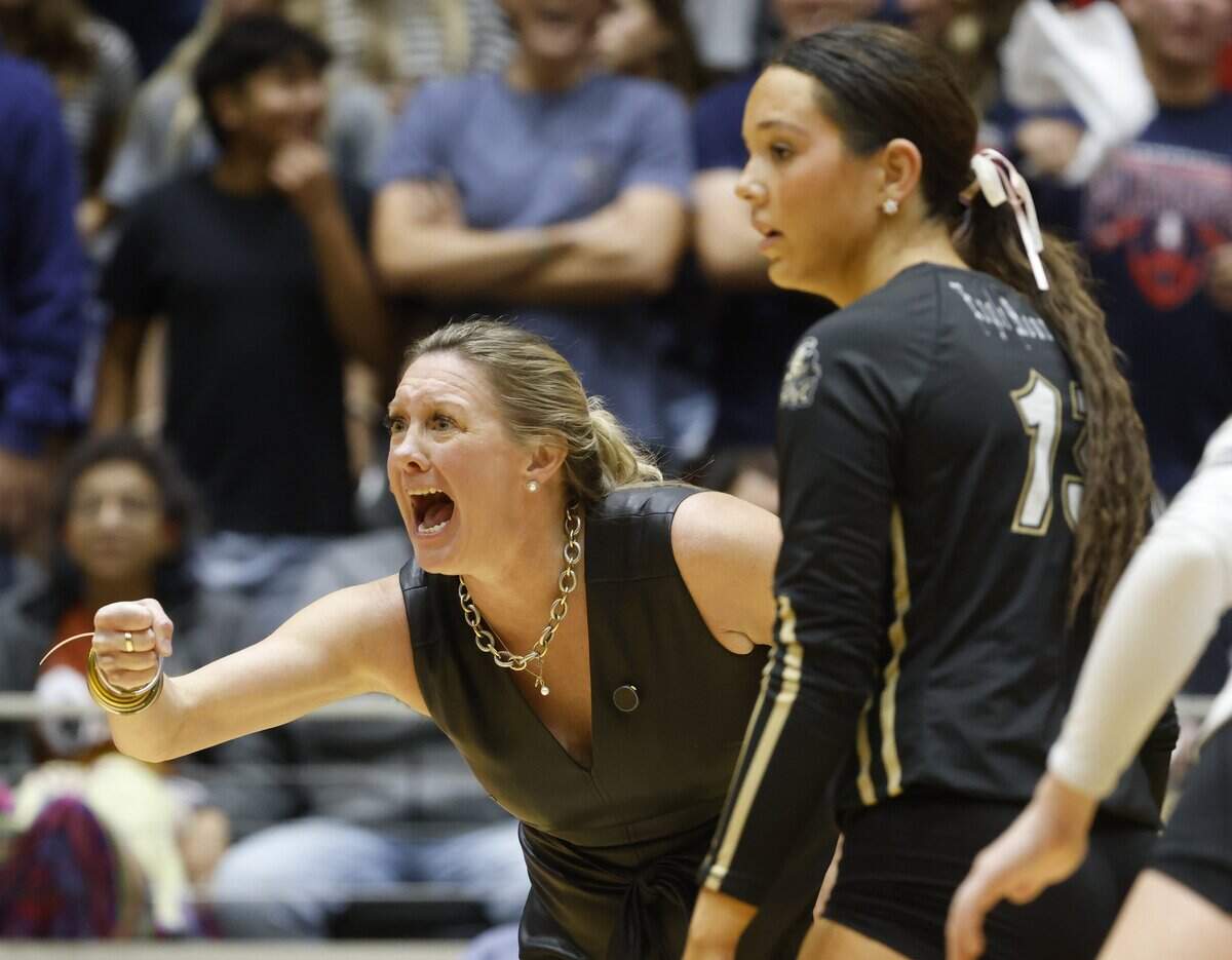 Fort Worth Eagle Mountain head coach Catherine Foerster reacts to a point against Wimberley during the third set of the UIL Class 4A Division II state volleyball championship game Friday Nov. 21, 2025 at Curtis Culwell Center in Garland, Texas.