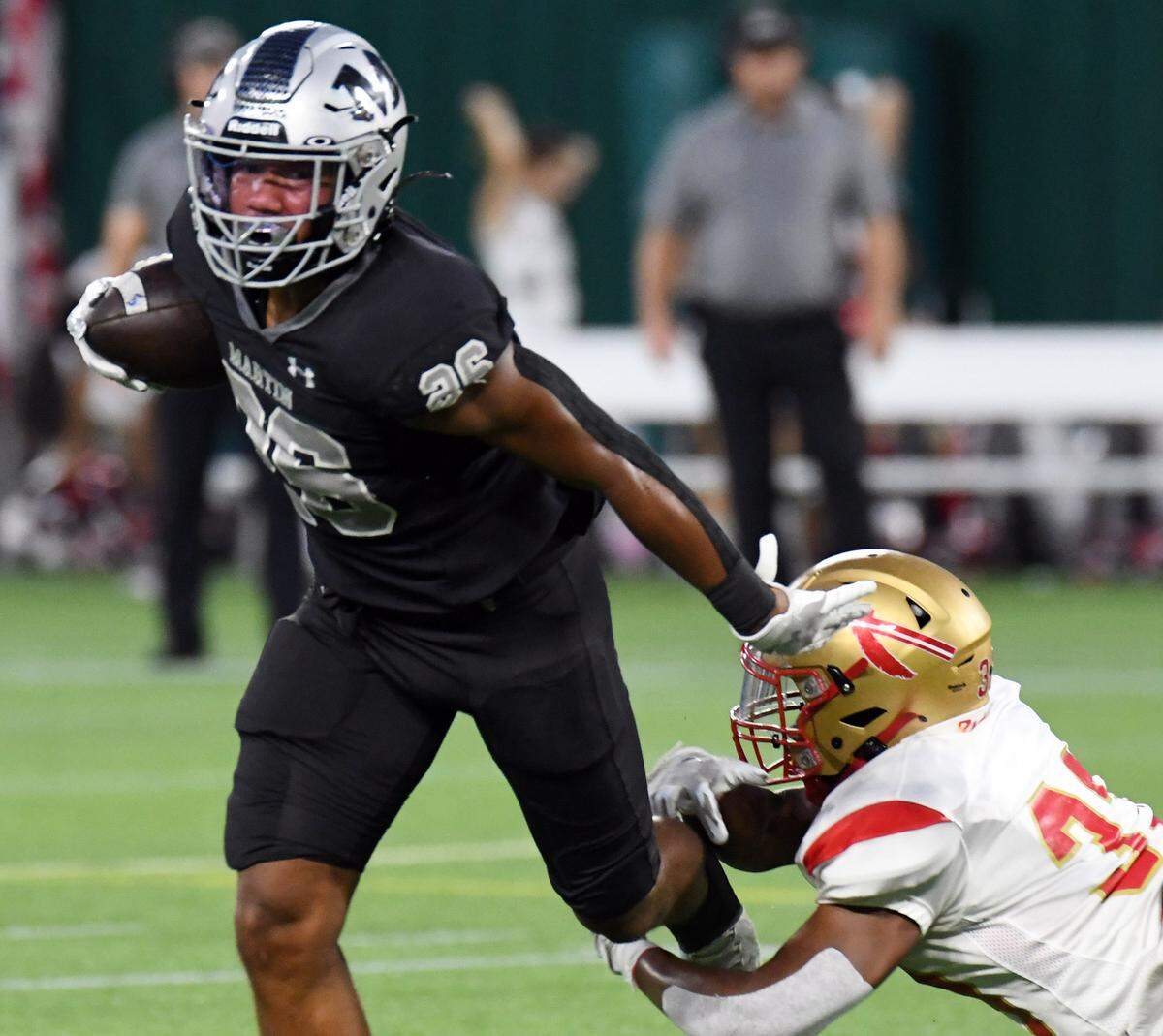 Arlington Martin’s Sergio Snider, left breaks away from South Grand Prairie for a first down in the first quarter of their District 8-6A match football game at Choctaw Stadium in Arlington, Texas. Special/Bob Haynes