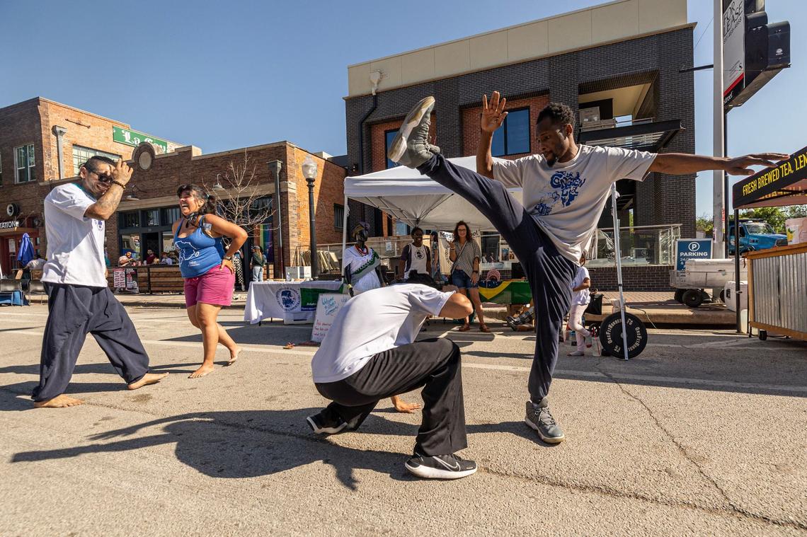 Lawrence French and Luis Muela of Fort Worth Capoeira do a Brazilian Martial Arts demonstration at Open Streets on Magnolia Avenue in Fort Worth on Saturday, April 13, 2024. Open Streets is a national movement encouraging innovative ways to achieve environmental, social, economic, and public health goals by temporarily closing streets to automobile traffic, so that people may use them for walking, bicycling, dancing, playing, and socializing.