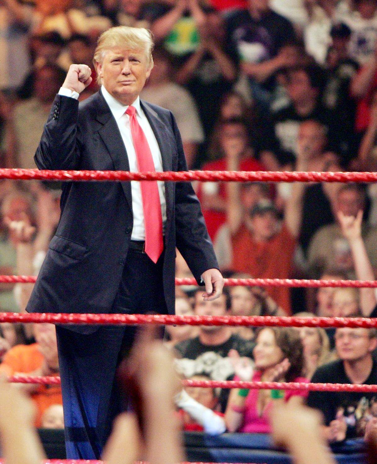 As the new owner of World Wrestling Entertainment’s “Monday Night RAW,” Donald Trump gets cheers from the crowd on June 22, 2009, during a live show of “RAW” at the Resch Center in Ashwaubenon, Wisconsin.
