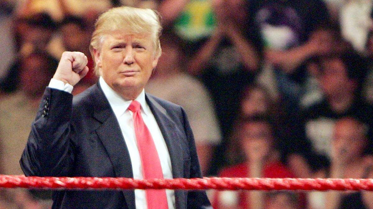 As the new owner of World Wrestling Entertainment’s “Monday Night RAW,” Donald Trump gets cheers from the crowd on June 22, 2009, during a live show of “RAW” at the Resch Center in Ashwaubenon, Wisconsin.