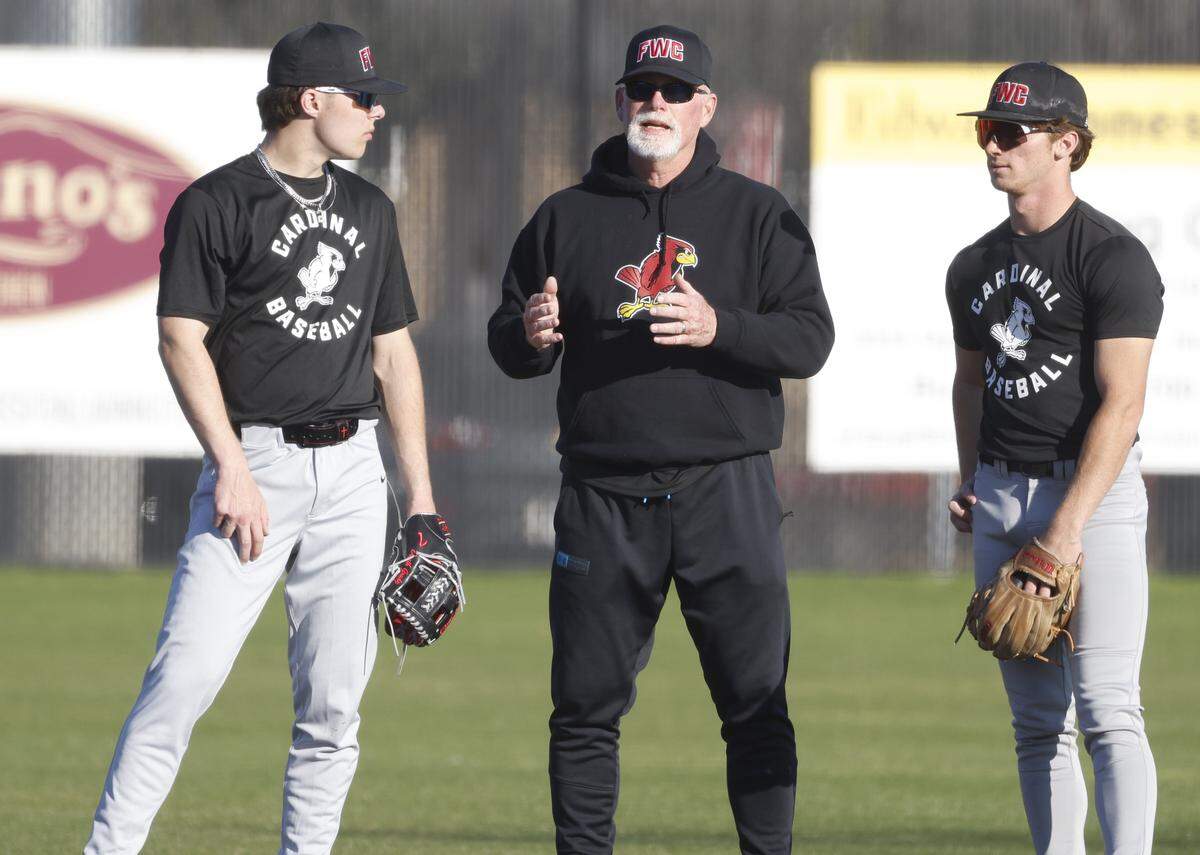 Fort Worth Christian head coach Rusty Greer talks to short stop Grady Emerson and second baseman Griffin Carney during baseball practice at Fort Worth Christian School in North Richland Hills, Texas, Monday Feb. 23, 2026.
