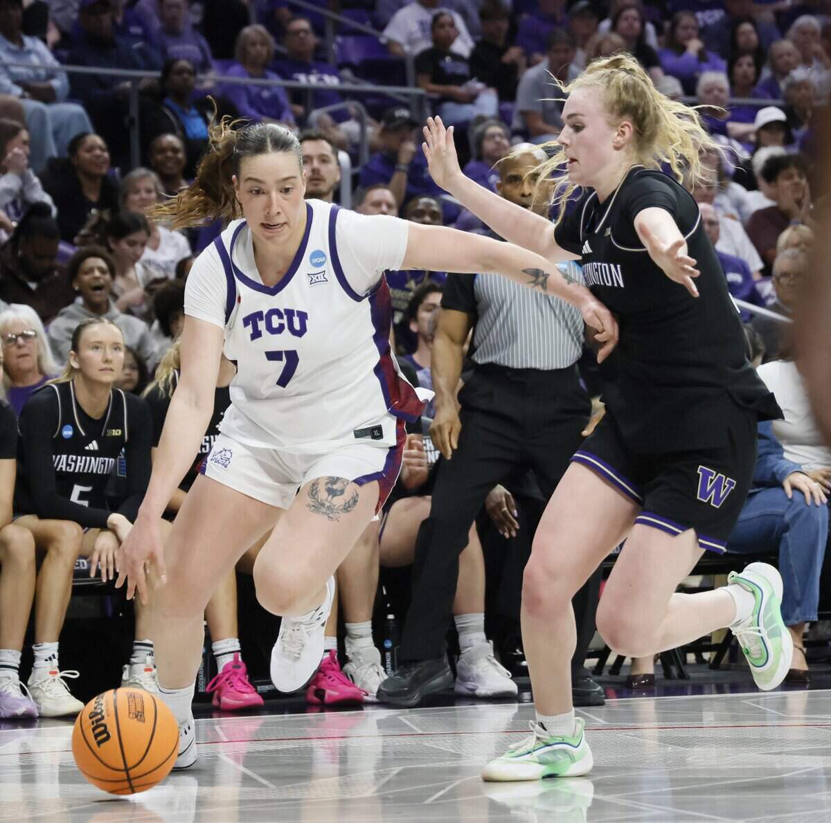 TCU forward Marta Suarez (7) turns the corner on Washington guard Avery Howell (2) during the first half of a second round NCAA Division I Women's Basketball Championship game at Schollmeier Arena in Fort Worth, Texas, Sunday, March, 22, 2026.