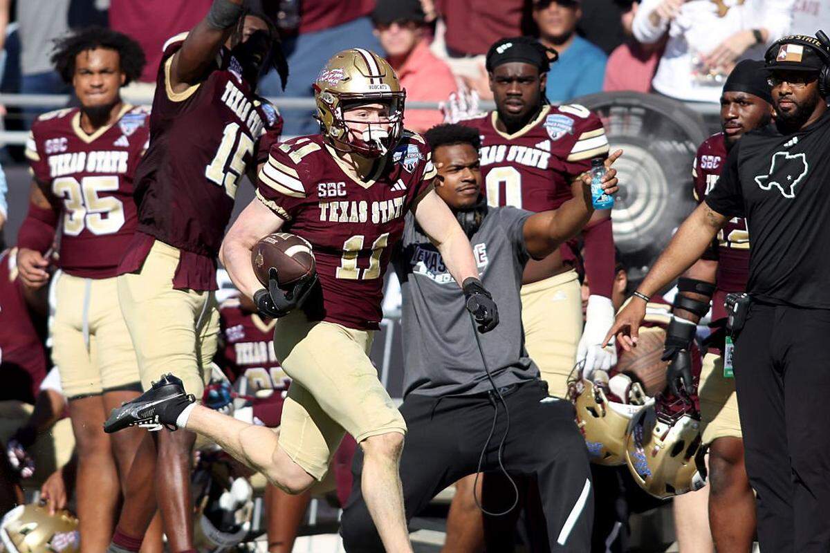 FORT WORTH, TEXAS - JANUARY 02: Beau Sparks #11 of the Texas State Bobcats runs for a touchdown against the Rice Owls during the first half of the 2026 Lockheed Martin Armed Forces Bowl at Amon G. Carter Stadium on January 02, 2026 in Fort Worth, Texas. (Photo by Tim Heitman/Getty Images)