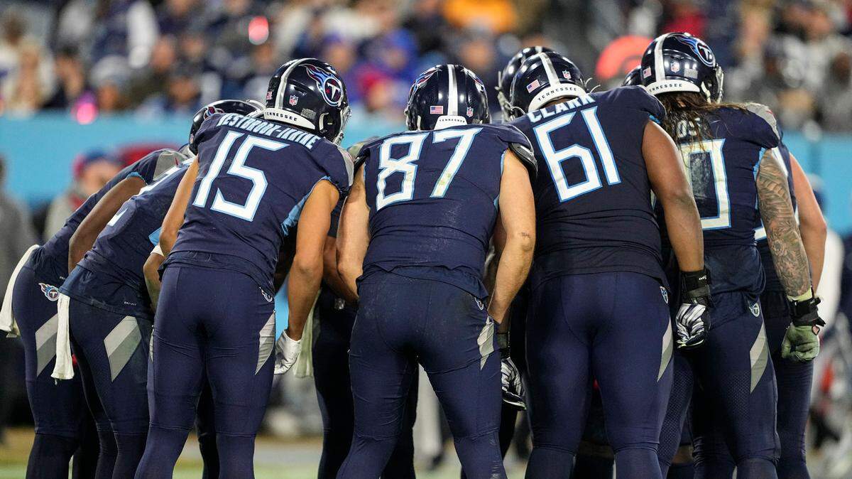 Tennessee Titans huddle before a play during the second half of an NFL football game between the Tennessee Titans and the Dallas Cowboys on Thursday. 