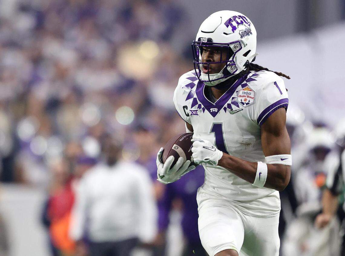 TCU wide receiver Quentin Johnston runs the ball at the Vrbo Fiesta Bowl at State Farm Stadium in Glendale, Ariz., on Saturday, December 31, 2022.