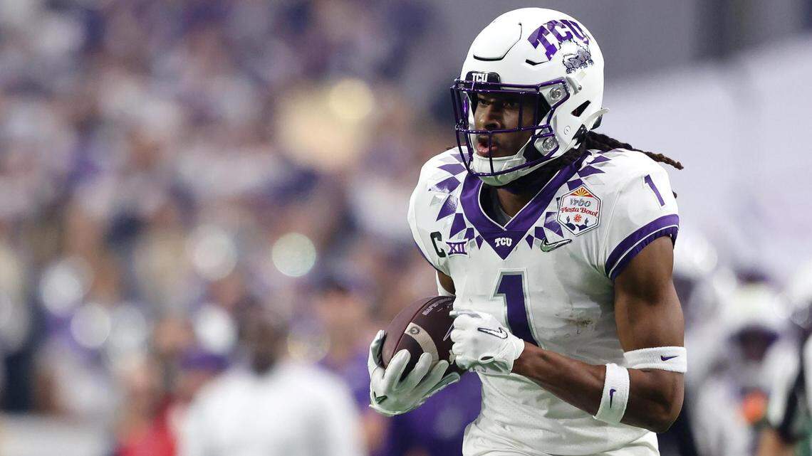 TCU wide receiver Quentin Johnston runs the ball at the Vrbo Fiesta Bowl at State Farm Stadium in Glendale, Ariz., on Saturday, December 31, 2022.