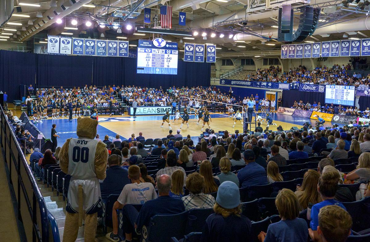 Fans cheer during an NCAA college volleyball game between BYU and Utah State in Provo Utah, Sept. 1, 2022. An investigation by Brigham Young University into allegations that fans engaged in racial heckling and uttered racial slurs at a Duke volleyball player last month found no evidence to support the claim.