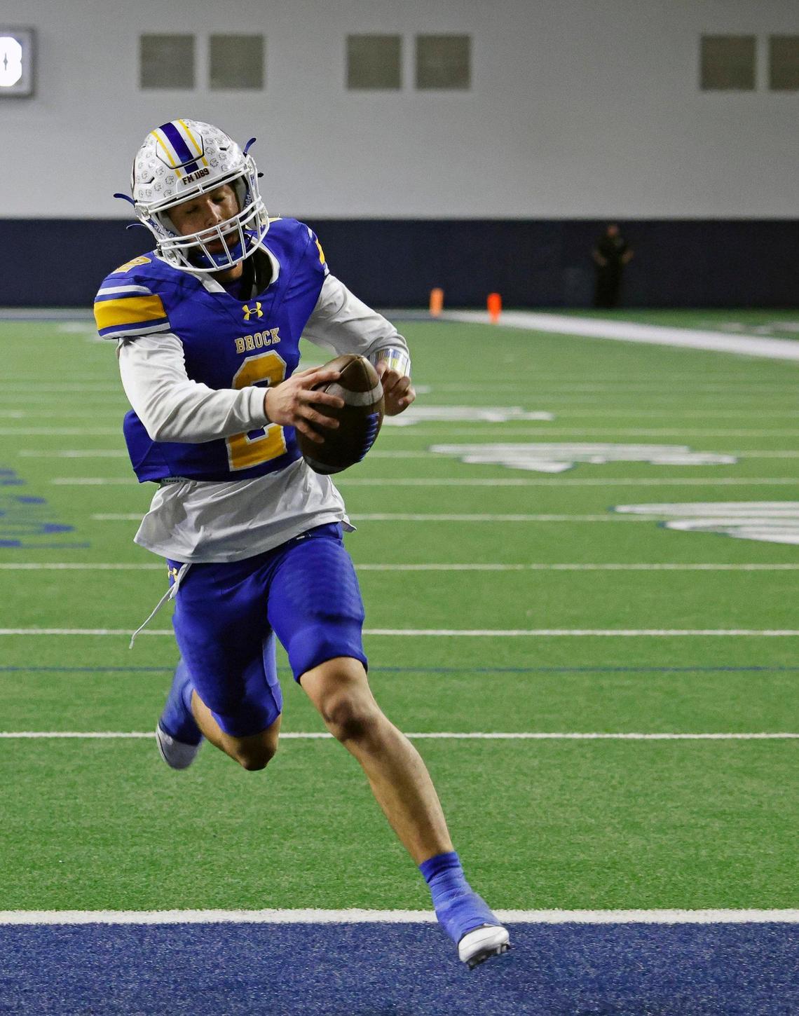 Brock quarterback Brody Woods (2) extends the ball as he crosses the goal line during the second half of a UIL Conference 3A Division 1 semifinal playoff football game at The Ford Center in Frisco, Texas, Thursday, Dec. 07, 2023.