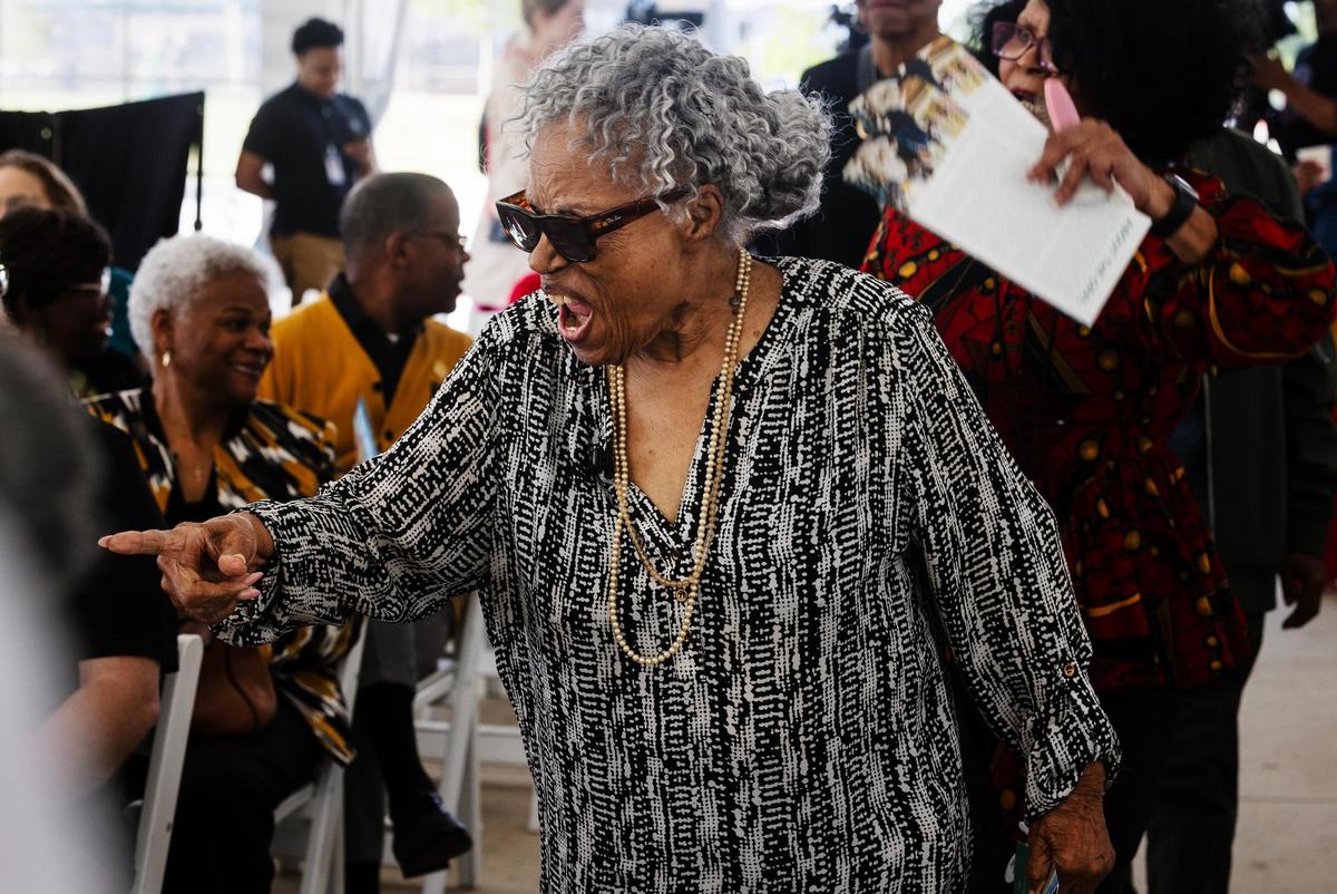 Opal Lee reacts to seeing guests at the grand opening of The Opal, a mixed-income apartment community, on Thursday, April 17, 2025. The affordable housing property was named in honor of Lee.