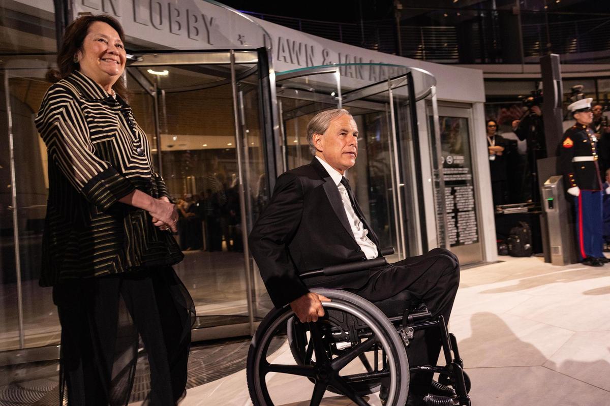 Texas Governor Greg Abbott arrives with his wife Cecilia for the ribbon cutting portion of the National Medal of Honor Museum Grand Opening Celebration in the Arlington Entertainment District on Saturday, March 22, 2025.