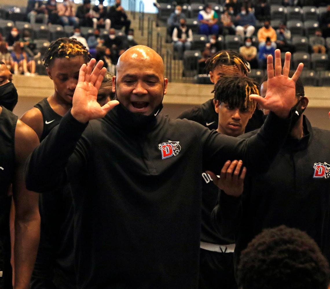 Duncanville head coach David Peavy talks to the team during a timeout in the first half of a 6A Region 1 quarterfinal basketball game at Arlington ISD Athletics Complex in Arlington, Texas, Saturday, Feb. 27, 2021. Duncanville led 38-23 at the half. (Special to the Star-Telegram Bob Booth)