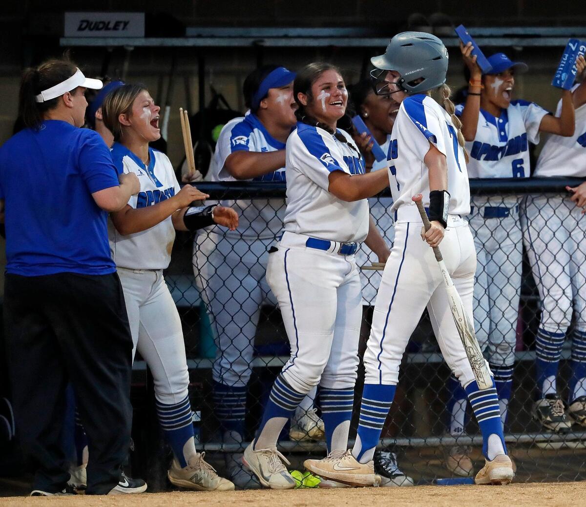 Burleson Centennial’s Lacie Mendez (44) congratulates Kendall Miller (7) after Miller’s run tied the game during a UIL 5A Region 1 quarter-final playoff softball name at Spartans Softball Field in Mansfield, Texas, Wednesday, May 11, 2022. Centennial defeated Northwest 7-5 in game one. Game two will be at Northwest High School Thursday with game three at Weatherford High School if necessary. (Special to the Star-Telegram Bob Booth)