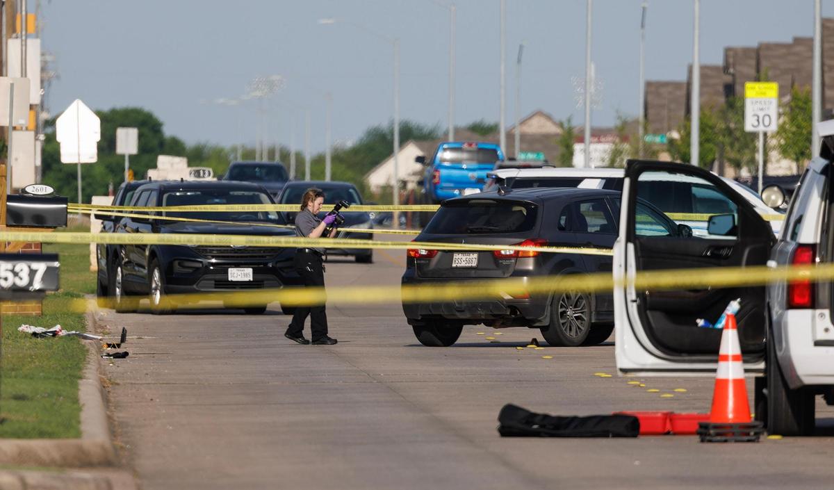 Law enforcement officers investigate a shooting scene on North Crowley Cleburne Road in front of J.A. Hargrave Elementary School, in Crowley ISD, on Monday, April 14, 2025.