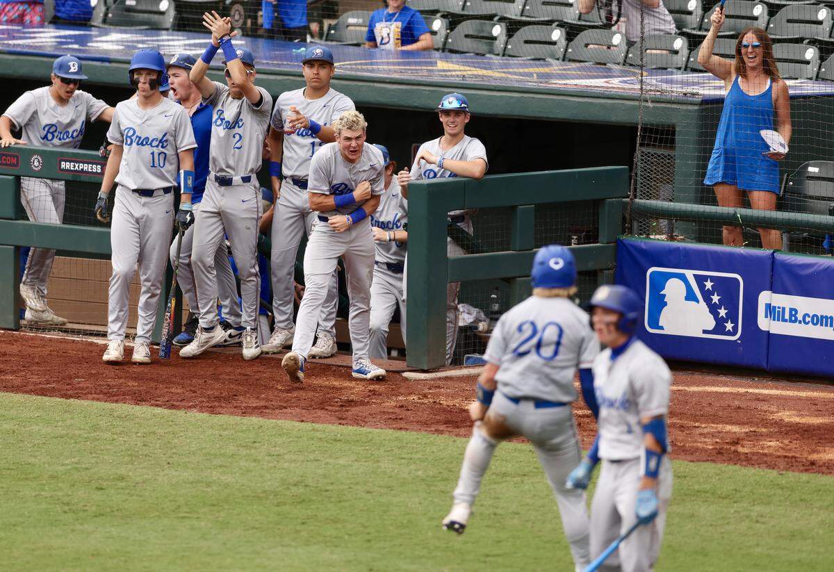 Brock’s Asher Strait (20) celebrates with his teammates after scoring the Eagles first run against Robinson in the UIL Class 4A Division II baseball state championship game on Friday, June 5, 2026, at Dell Diamond in Round Rock, Texas.