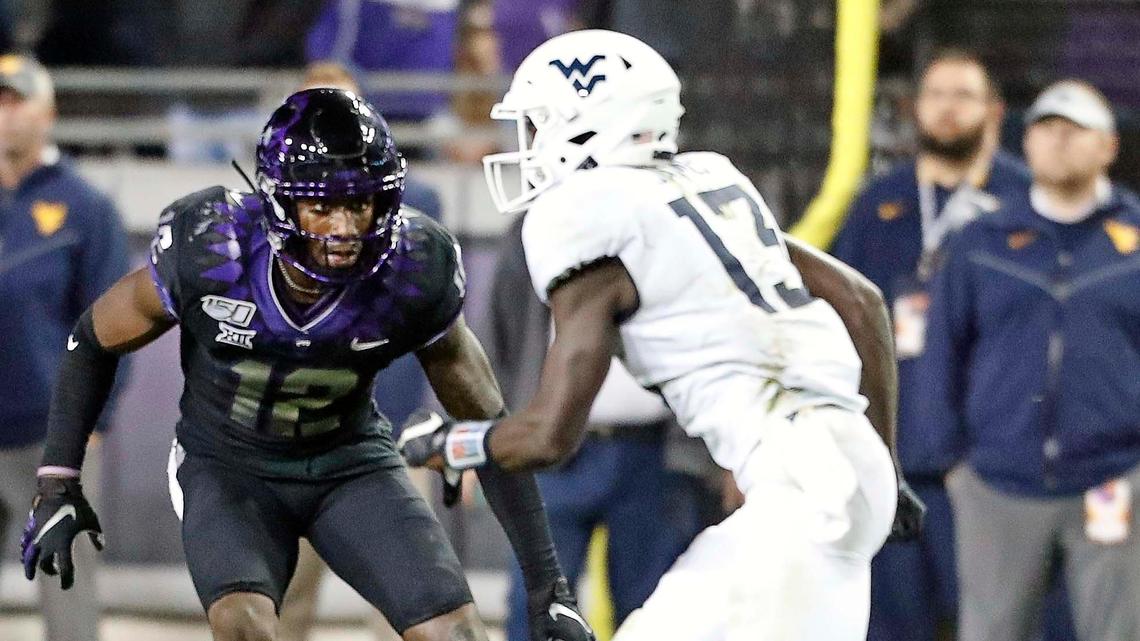 TCU corner back Jeff Gladney (12) zeros in on West Virginia wide receiver Sam James (13) in the fourth quarter of a NCAA football game at Amon G. Carter Stadium in Fort Worth, Texas, Friday, Nov. 29, 2019. West Virginia defeated TCU 20-17. (Special to the Star-Telegram Bob Booth)