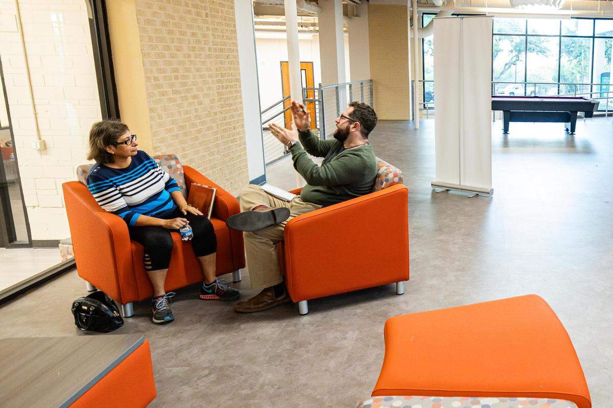 Diana Garcia Rios speaks with reporter Harrison Mantas while visiting the Fort Worth Star-Telegram’s Mobile Newsroom in the Northside Community Center on Nov. 14.