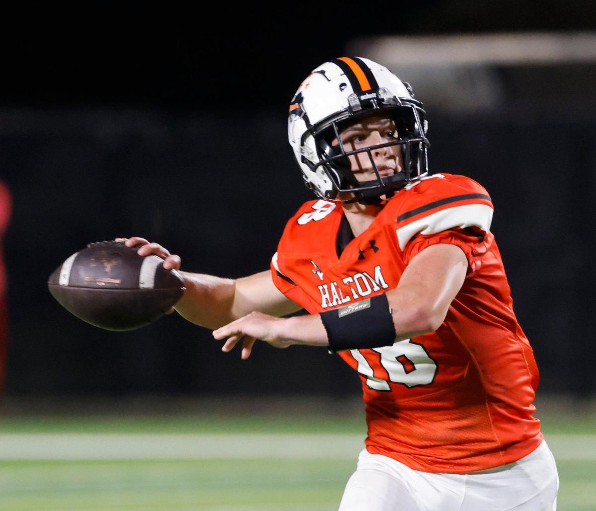 Haltom sophomore quarterback Gage Seely (18) tosses downfield during a UIL District 8-6A football game at Birdville Fine Arts/Activity Complex in North Richland Hills, Texas, Thursday, Oct. 31, 2024.