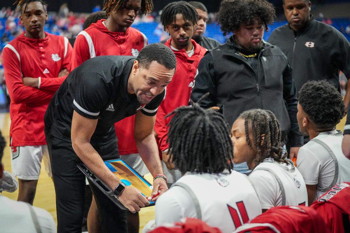 Hitchcock head coach Christopher Jordan-Foster addresses his team during a time out against San Antonio Cole in a Class 3A state semifinal on Thursday, March 7, 2024 at the Alamodome in San Antonio, Texas. Hitchcock defeated Cole 57-40.