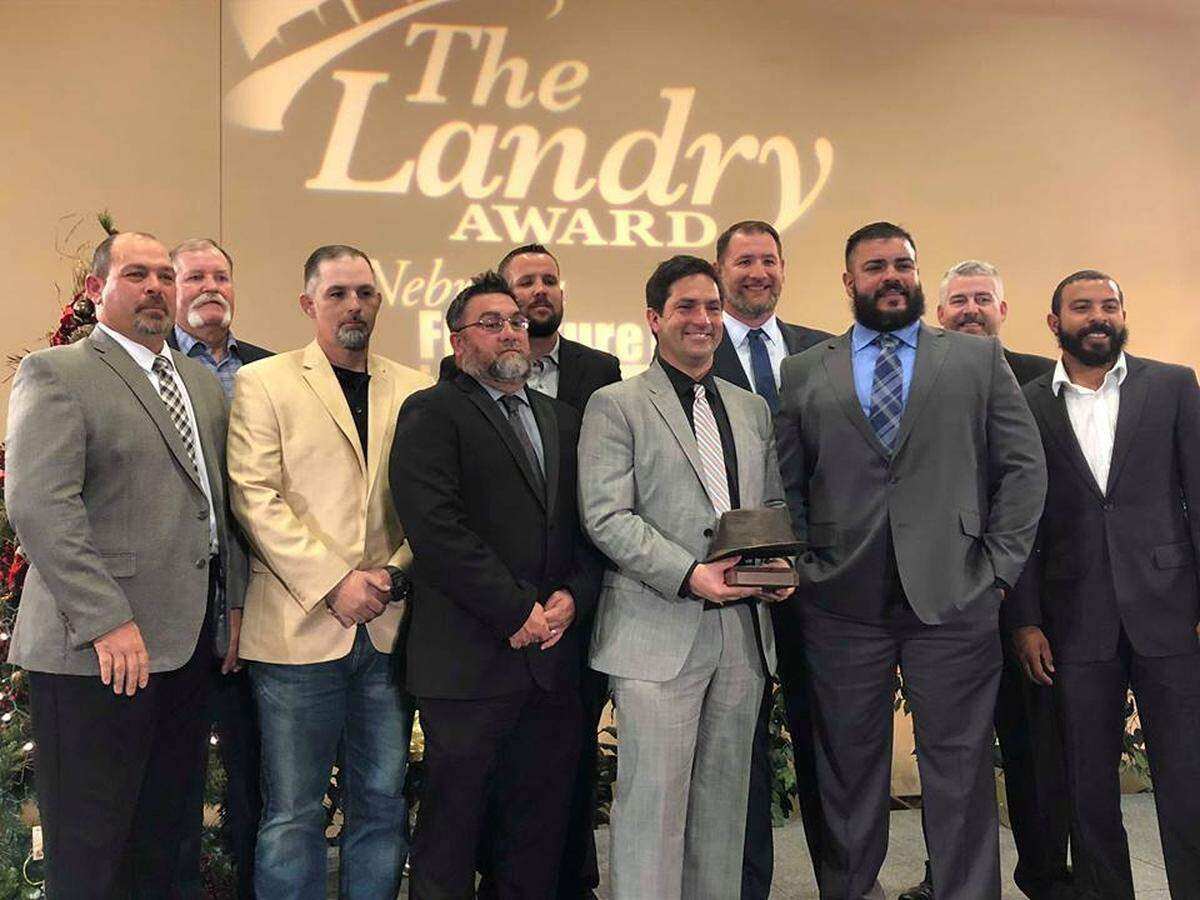 Haltom coach Jason Tucker (middle) and the rest of the Buffalo football coaches at The Hope Center in Plano for the 2018 Landry Award. Tucker was named Coach of the Year.