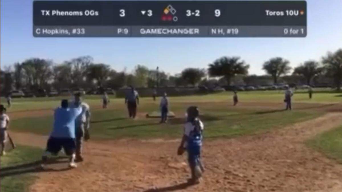 A viral video shows a youth baseball coach shoving an umpire to the ground during a game in The Colony on Saturday.