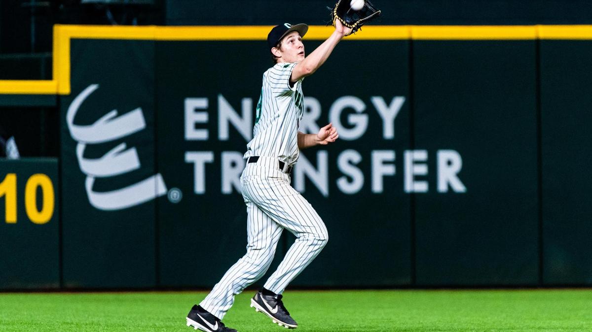 Tanner Sumer (19) catches a ball in deep left field during a game between Carroll and Prosper at Globe Life Field in Arlington during the High School Baseball Showcase on February 28, 2021. Photo by Matt Smith. (Special to the Star-Telegram).