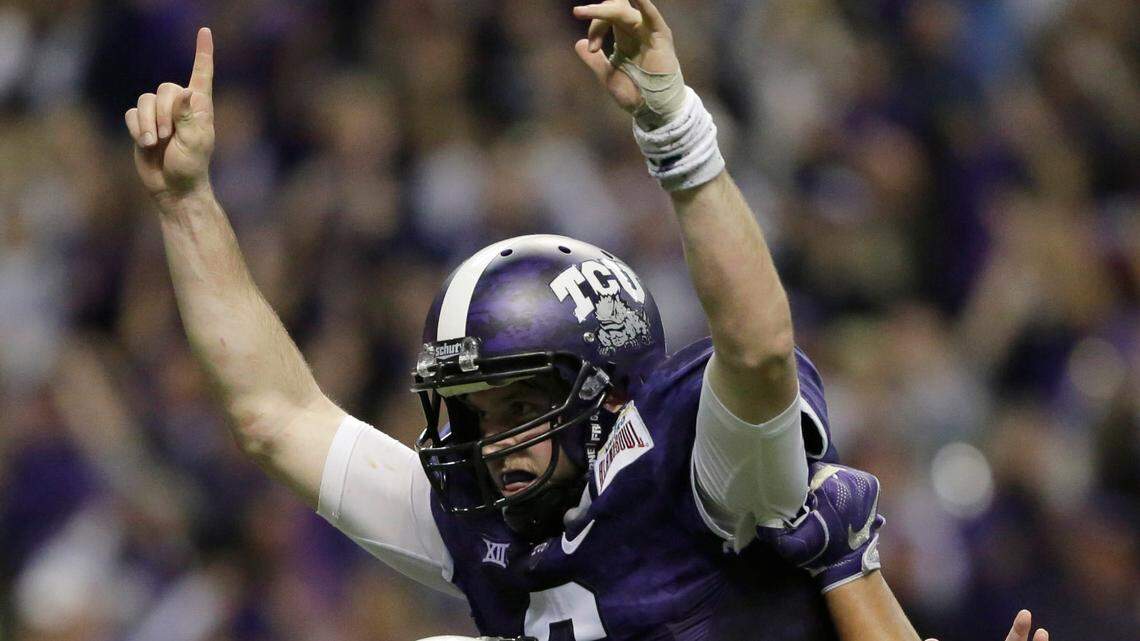 TCU’s Bram Kohlhausen (6) is lifted by teammate Halapoulivaati Vaitai (74) after he threw a TD pass in the Alamo Bowl on Jan. 2, 2016. Over the weekend, Kohlhausen suffered a variety of serious injuries stemming from a hunting accident.