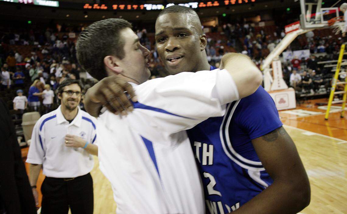 North Crowley guard Willie Warren (right) celebrates with coach Tommy Brakel after the Panthers defeated Fort Bend Dulles 73-67 in the Class 5A boys basketball state championship game March 8, 2008, at the Frank Erwin Center in Austin.