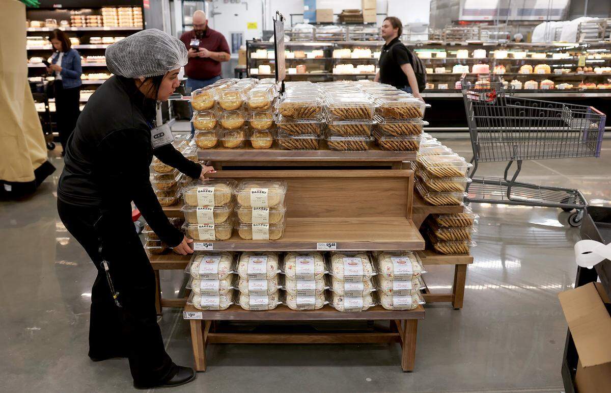 Ashley Castillo stocks baked goods at the Mid-Cities H-E-B on Tuesday, May 19, 2026. The popular Texas grocery store will open to the public on May 20.
