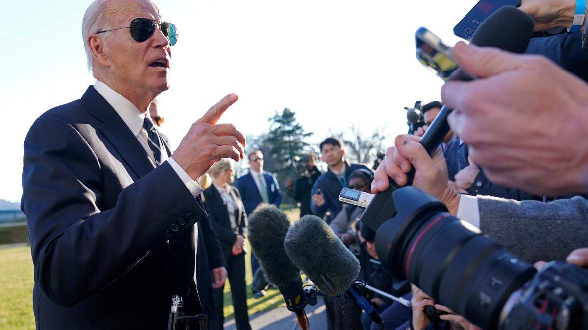 President Joe Biden talks with reporters on the South Lawn of the White House in Washington, Monday, Jan. 30, 2023, after returning from an event in Baltimore on infrastructure. (AP Photo/Susan Walsh)