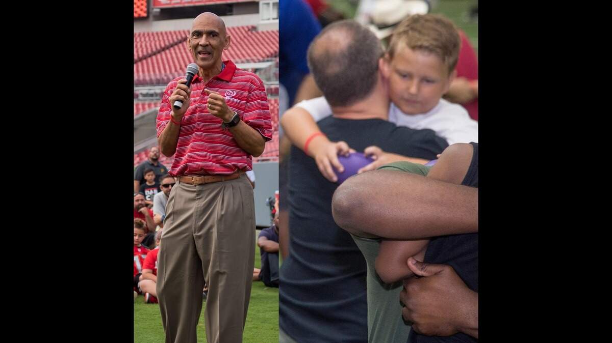 Pro Football Hall of Fame member Tony Dungy, left, started his All Pro Dad foundation 25 years ago, a nonprofit foundation that encourages dads to be involved in their children’s lives. All Pro Dad held an event in May at TCU where dads played and spent time with their kids.