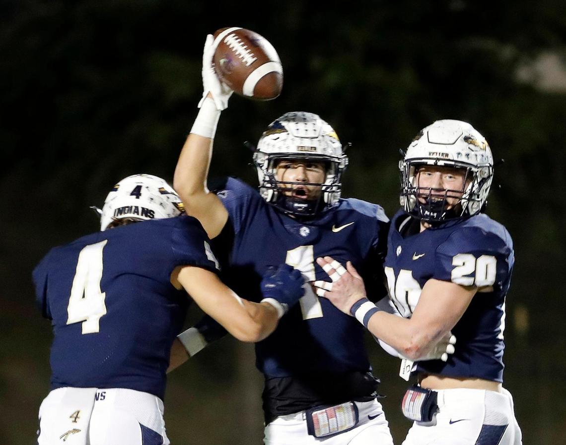 Keller defensive backs Eli Brinton (4) and Jay Powitz (20) celebrate Matthew Anderson’s (1) interception in the first half of a District 4-6A high school football game at Keller ISD Stadium in Keller, Texas, Thursday, Oct. 27, 2022. Keller led Timber Creek 20-3 at the half. (Special to the Star-Telegram Bob Booth)