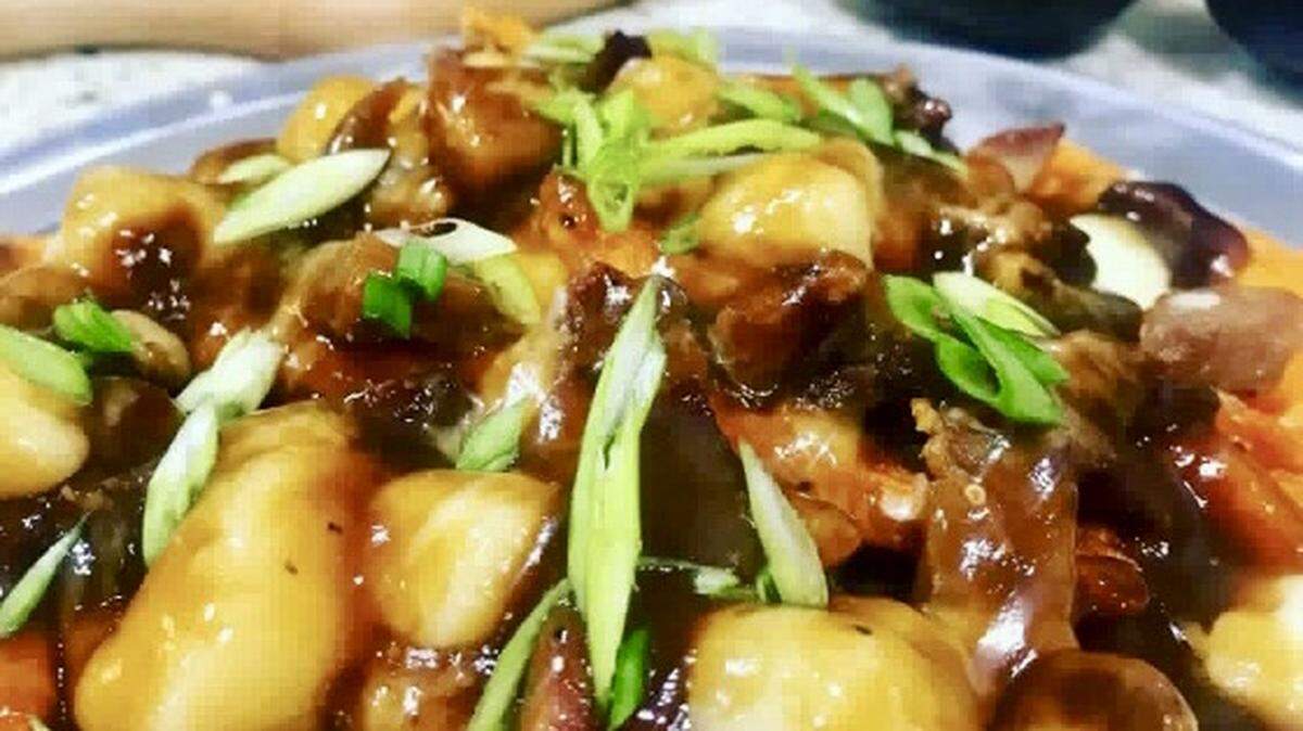 Smoked pork belly poutine is a menu item at the Tipsy Oak in downtown Arlington.