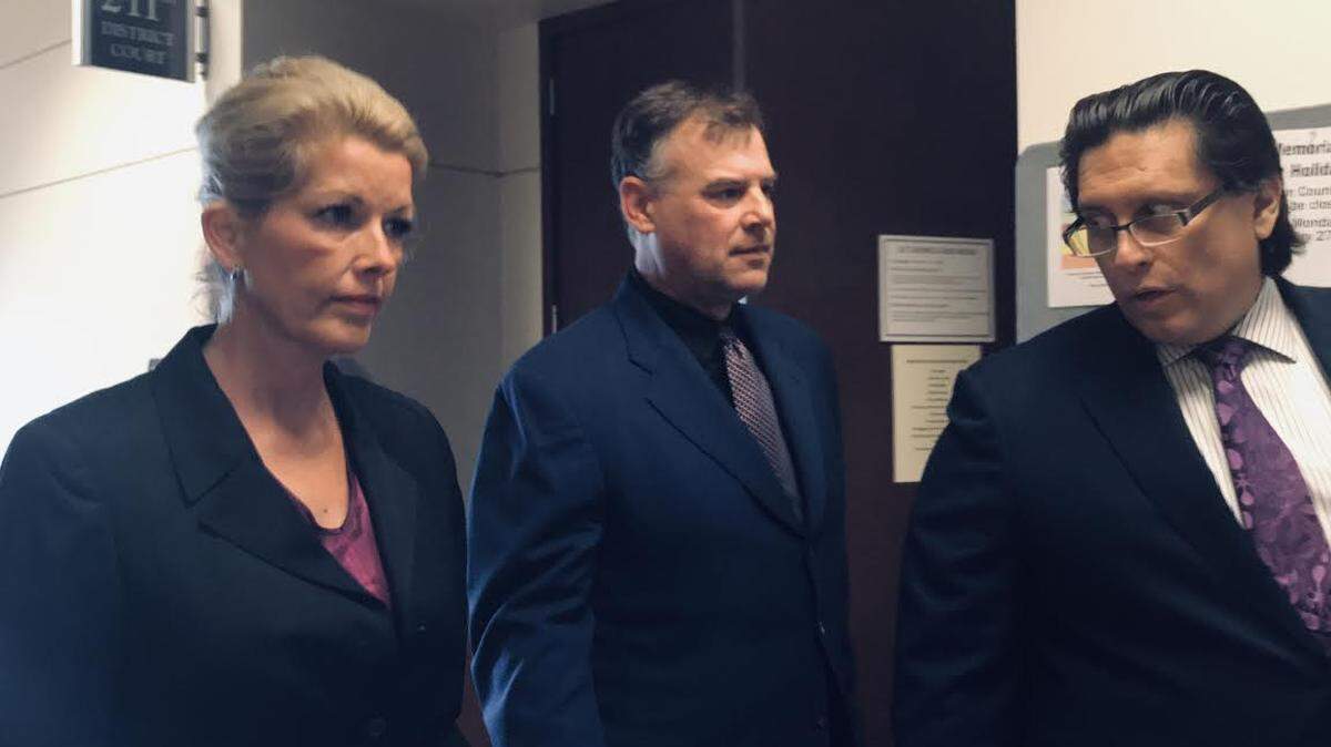 Former Texas Rangers pitcher John Wetteland (center) appeared in a Denton County Court on Monday to respond to charges of three counts of aggravated assault against a child. Wetteland was joined by his wife, Rebecca, and his attorney, Derek Adame.