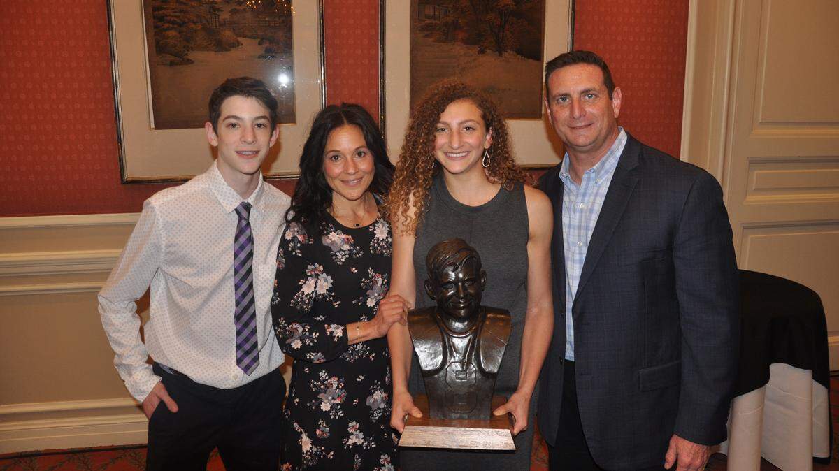 Frisco Wakeland senior Hannah Mandell, second from right, wins the 33rd annual Davey O’Brien High School Scholarship Award, Tuesday Jan. 22, 2019. She’s alongside brother Josh, mother Jessica and father Mark.