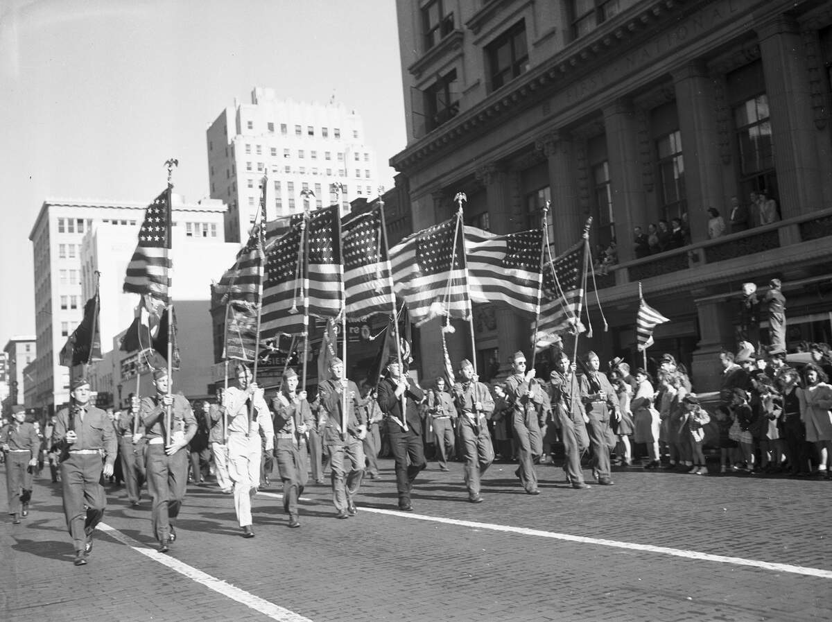 Nov. 11, 1943: Massed flags from Fort Worth Army and American Legion posts lead the parade through downtown streets Thursday morning in the observance of the 25th anniversary of Armistice Day.