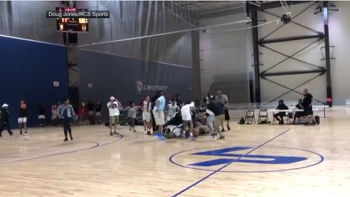 A massive brawl broke out at an AAU tournament between players and refs.