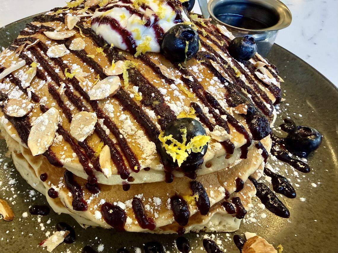 Lemon ricotta pancakes with blueberry drizzle at Top Of The Morning.