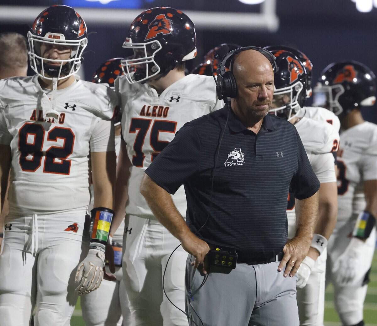 Aledo head coach Robby Jones walks off the field after a timeout during the first half of a UIL football game between against North Richland Hills Richland on Thursday, October, 23, 2025 at Birdville FAAC Stadium in North Richland Hills, Texas.